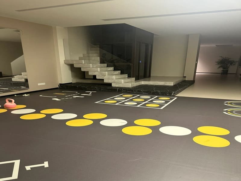 Sports court floor with tape lines and markings